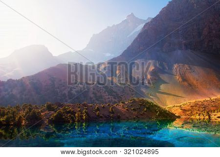 Fann Mountains In Tajikistan. Beautiful View On Fan Mountain Range In Morning Sunlight. Alaudin Lake