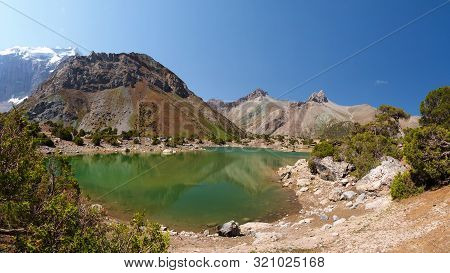Scenery Fann Mountains In Tajikistan. Wild Mountain Nature With Lake On Clear Day. Beautiful Kulikal