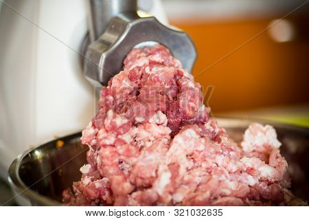 An Electric Meat Grinder Twists The Meat