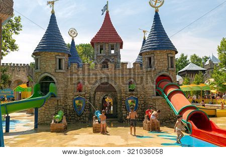 Castelnuovo Del Garda, Italy - August 13 2019: Children Play With Water, Ride From The Water Slide. 