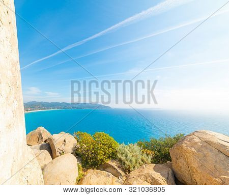 Sun Shining Over Porto Giunco Coastline. Sardinia, Italy