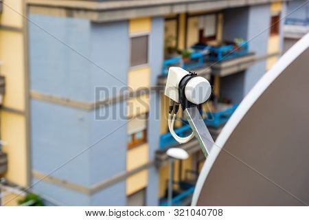Close Up Of A Satellite Dish And Lnb On A Balcony