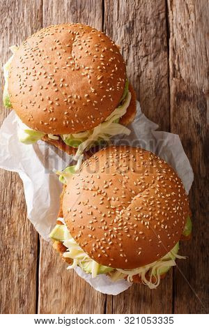 Mexican Cemita Sandwich With Meat, Cheese, Avocado And Sauce Close-up. Vertical Top View