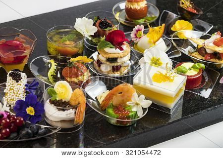 Mini Canapes For Refreshments At Banquets Receptions Catering On A Dark Background.