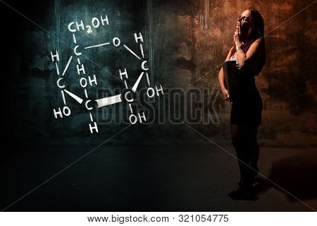 Sexy Girl Or Secretary Or Female Student Presenting Handdrawn Chemical Formula Of Glucose