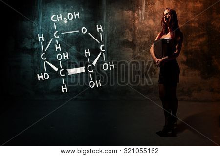 Sexy Girl Or Secretary Or Female Student Presenting Handdrawn Chemical Formula Of Glucose