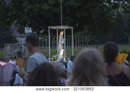Lourdes, France, 24 June 2019: Evening Procession With Candles At The Shrine Of Lourdes In France