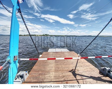 Shipping On Ferry Boat Ship With Open Ramp And Empty Car Deck. Wooden Board For Cars And Passenger