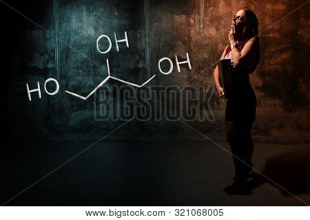 Sexy Girl Or Secretary Or Female Student Presenting Handdrawn Chemical Formula Of Glycerol