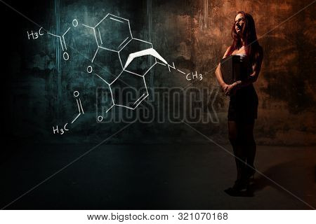 Sexy Girl Or Secretary Or Female Student Presenting Handdrawn Chemical Formula Of Heroin