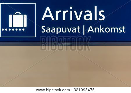 Blue Airport Arrivals Sign Board In Helsinki, Finland