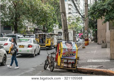 Manila, Philippines - March 5, 2019: Red-yellow Tricycle Taxi With Large Poster Of Bong Revilla, Act