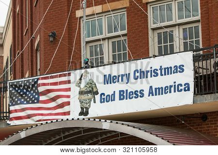 Suwanee, Ga / Usa - December 15:  A Banner With An Image Of Santa Claus Wearing Camouflage And Carry
