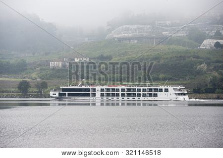 A Douro Cruise Ship In The Landscape On The Douro River At The Town Of Alpendurada, East Of Porto In