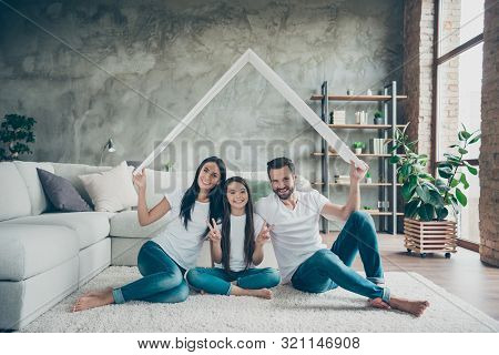 Portrait Of Nice Attractive Cheerful Family In Casual White T-shirts Jeans Sitting On Carpet Floor H