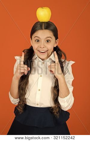 Eureka Concept. Distributing Free Fresh Fruit At School. Girl Kid School Uniform. Schoolgirl With Ap