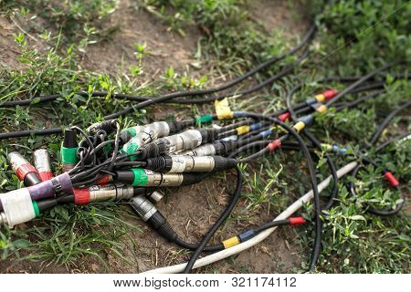 Connectors For Music And Microphone For A Festive Party. Wires With Connectors Xlr Lie On The Ground