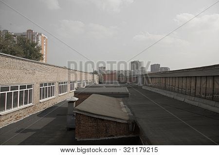 Long Roof Of An Urban Industrial Building