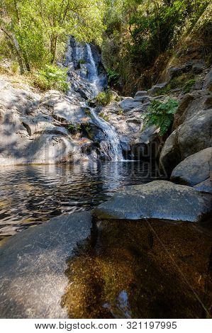 Serra Do Espinhal, Portugal - August 31, 2019 : Waterfall Pedra Ferida, Coimbra, Portugal