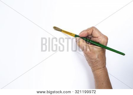 Senior Woman's Hand Painting With Paintbrush Isolated On White Background