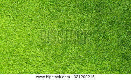 The Artificial Green Grass Pattern Texture Background.