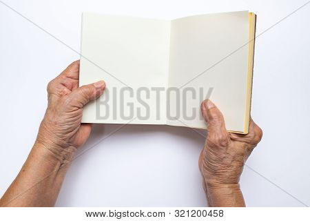 Senior Woman's Hand Holding On Notebook Isolated On White Background, , Stationery Concept