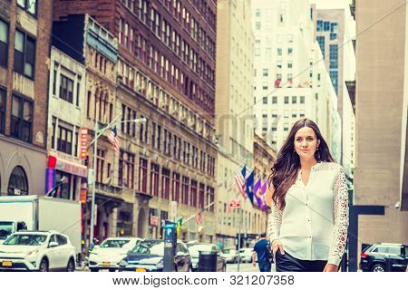 Young Eastern European Woman With Long Black Hair, Traveling In New York, Wearing White, Lace Cut Ou