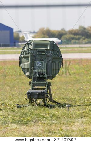 A Military Green Radar On The Field