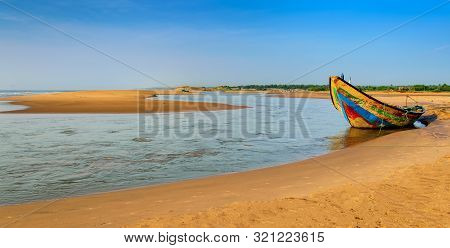 Traditional Colorful Fishing Boat Anchored At The Confluence Of Mahendra Tanaya River And Bay Of Ben