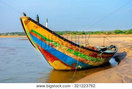 Traditional Colorful Fishing Boat Anchored At The Confluence Of Mahendra Tanaya River And Bay Of Ben