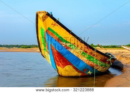 Traditional Colorful Fishing Boat Anchored At The Confluence Of Mahendra Tanaya River And Bay Of Ben