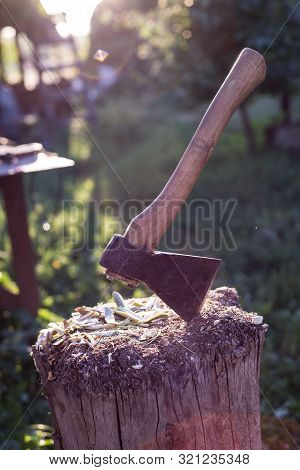 Tapor In A Wooden Bar On A Rustic Background. Chopping Wood