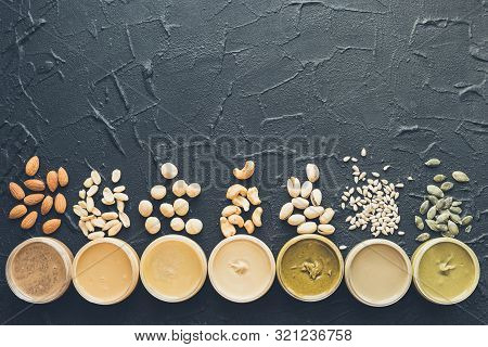 Nuts And Seeds Butter In Jars With Ingredients. Homemade Raw Organic Peanut, Almond, Hazlenut, Cashe