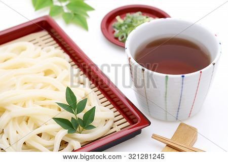 Japanese Chilled Zaru Udon Noodles In A Plate With Mentuyu On White Background