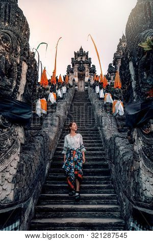 Traveler Standing At The Gates Of Pura Lempuyang Temple Aka Gates Of Heaven Bali, Indonesia