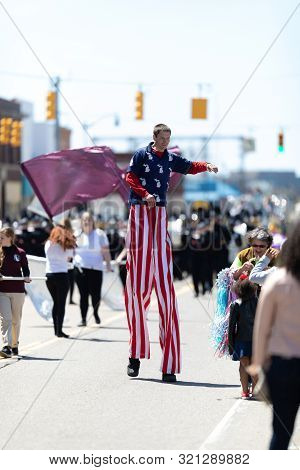 Benton Harbor, Michigan, Usa - May 4, 2019: Blossomtime Festival Grand Floral Parade, Man On Stilts 