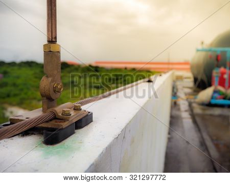Close-up Bare Copper And Cable Saddle Of Lightning Protection On Roof Top