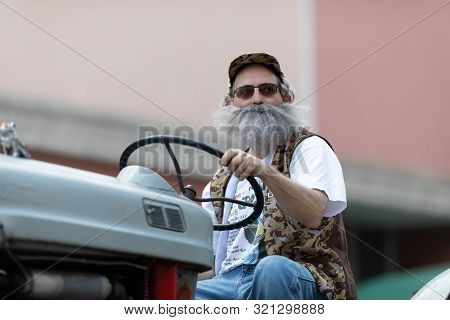 Buckhannon, West Virginia, Usa - May 18, 2019: Strawberry Festival, Old Tractors Being Driven Along 