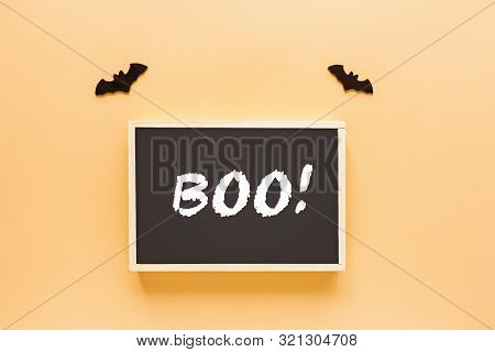 Boo - Halloween Decoration On Orange Background. Halloween Decoration With Boo And Bats. Flat Lay, T