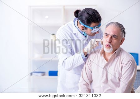 Male patient visiting doctor otolaryngologist
