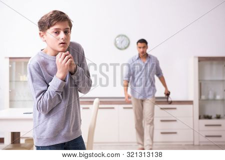 Father beating and punishing his sone