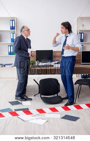 Forensic investigator investigating theft in the office