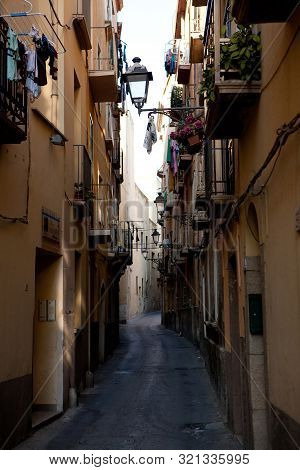 Trapani, Italy - August 20, 2013: Narrow Street In Trapani Old Town With Small Balkonies And Street 