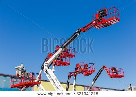 Fragment Of The Booms With Baskets And Top Parts Of Different Articulated Boom Lifts And Scissor Lif