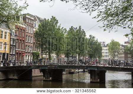 Amsterdam, Holland - July 1, 2017: Amsterdam Is One Of The Most Well Known Bicycle Friendly Cities W