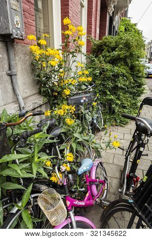 Amsterdam, Holland - July 1, 2017: Amsterdam Is One Of The Most Well Known Bicycle Friendly Cities W