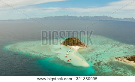 Aerial Seascape Tropical Island And Sand Beach, Turquoise Water And Coral Reef. Malacory Island, Phi