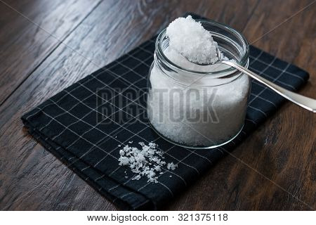 Maldon Sea Salt Flakes In Jar With Spoon.
