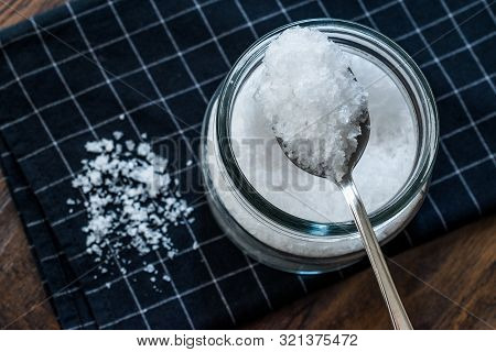 Maldon Sea Salt Flakes In Jar With Spoon.
