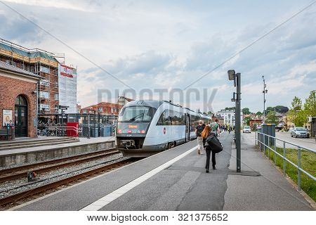 Passengers Embarking A Train At The Railway- Station In Svenborg, Denmark, Jjuly 10, 2019